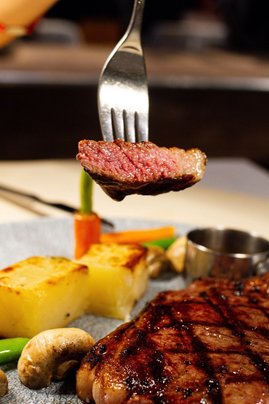 Grilled steak with roast potato and vegetables